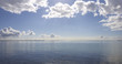 An early morning photo of young people kayaking on the ocean