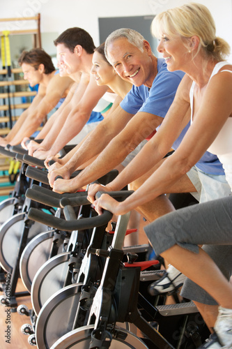 Photo: Senior Man Cycling In Spinning Class In Gym Senior Man Cycling In Spinning Class In Gym