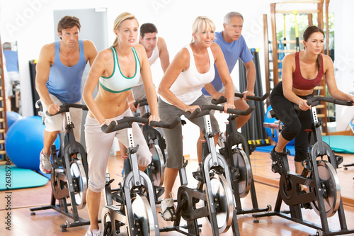 Photo: Group Of People In Spinning Class In Gym Group Of People In Spinning Class In Gym