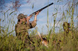 Hunter aiming at the hunt during a hunting party Hunter aiming at the hunt during a hunting party