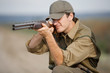 Hunter aiming at the hunt during a hunting party Hunter aiming at the hunt during a hunting party
