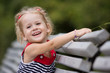 laughing girl on a bench laughing girl on a bench