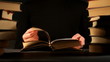 Hands and book over dark background Hands and book over dark background
