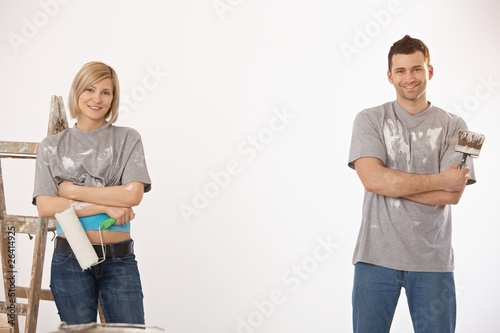 Photo: Portrait of couple painting at home Portrait of couple painting at home