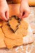little girl with cutter make a christmas tree cookie little girl with cutter make a christmas tree cookie