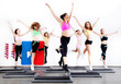 group of women doing aerobics on stepper