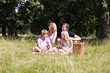 A family sitting together on the grass