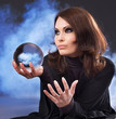 Young woman with crystal ball. Young woman with crystal ball.