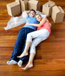 Young couple lying on floor