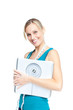 bright woman holding a scale and a measuring tape smiling at the bright woman holding a scale and a measuring tape smiling at the