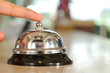 Hand of a woman using a hotel bell -a series of HOTEL images.
