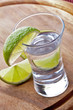 shot glass filled with clear cold alcohol shot glass filled with clear cold alcohol
