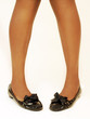 Lady wearing black flat ballerina shoes