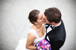 Young married couple kiss