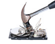 Hard drive being destroyed with hammer, isolated