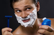 Handsome man shaving