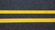 View of asphalt with distinct two yellow stripes