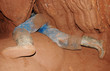 Caver in a narrow passage