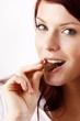 beautiful young woman with a bar of chocolate