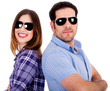 stylish couple posing back to back