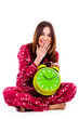 teenager sitting with alarm clock