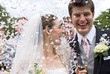 Bride and Groom in confetti shower