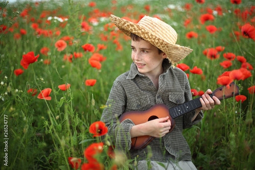 Photo: boy playing guitar boy playing guitar