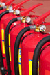 Group of ready fire extinguishers for use