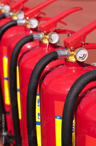 Photo: Group of ready fire extinguishers for use Group of ready fire extinguishers for use