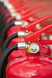 Group of ready fire extinguishers for use