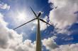 Wind turbine over a cloud filled blue sky, alternative energy so Wind turbine over a cloud filled blue sky, alternative energy so