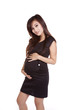 Pregnant woman business attire holding belly