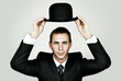 Holding Bowler Hat
