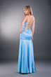 pretty white woman wearing blue evening dress