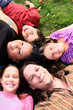 Photo: Family laying on the grass Family laying on the grass
