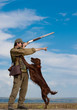 Hunter training the hunting dog during hunt Hunter training the hunting dog during hunt