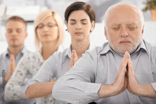 Photo: Meditating team portrait Meditating team portrait