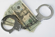 Close-up handcuffs and money