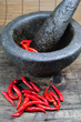 Chillies with mortar and pestle Chillies with mortar and pestle