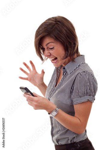 Photo: woman shouting to a mobile woman shouting to a mobile