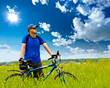 man with bike on green field man with bike on green field