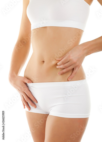 Photo: Slim woman isolated on white background Slim woman isolated on white background