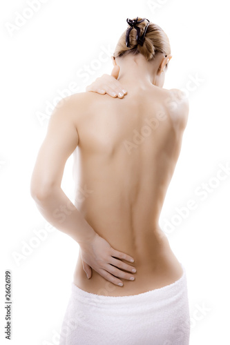Photo: Woman massaging pain back isolated on white Woman massaging pain back isolated on white