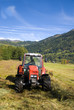 Tractor plowing field on a sunny autumn day.