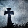 Grunge image of a cross in the cemetery, perfect halloween backg