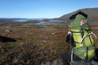 female hiker takes a look into the wild landscape female hiker takes a look into the wild landscape