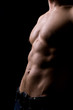torso of strong athletic man on black torso of strong athletic man on black