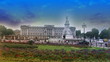 Traffic at Buckingham Palace with blue sky in slow motion