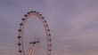 Focus on the London eye at sunset