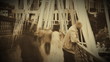 Video: Man on a bridge with abstract people walking on the background Man on a bridge with abstract people walking on the background
